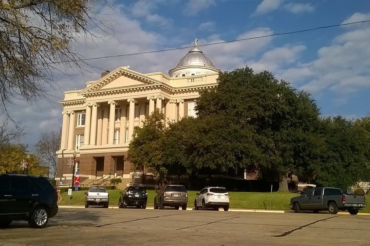 Anderson County Courthouse in Texas with domed roof and columns, representing property tax protest and appeal services by Tax Cutter. 
