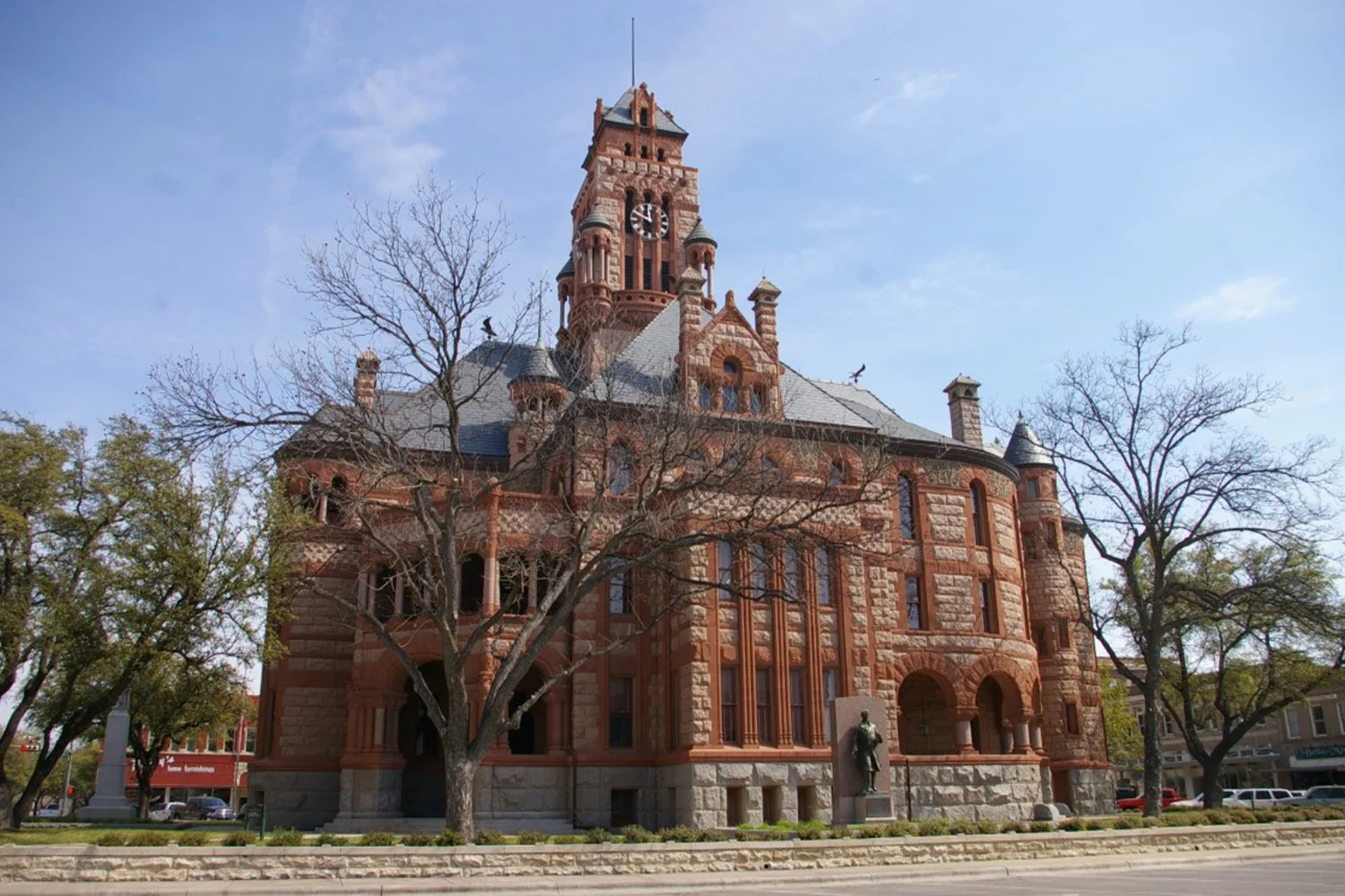 Ellis County Courthouse with clock tower and detailed architecture, symbolizing property tax appeal and protest services by Tax Cutter in Houston, Texas.