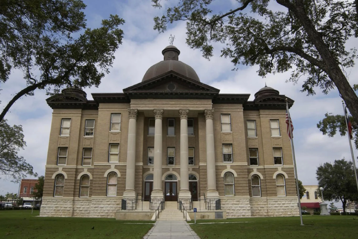 Hays County Courthouse in Texas, showcasing its classic architecture, representing the venue for property tax appeals, with Tax Cutter offering expert services to reduce property taxes.