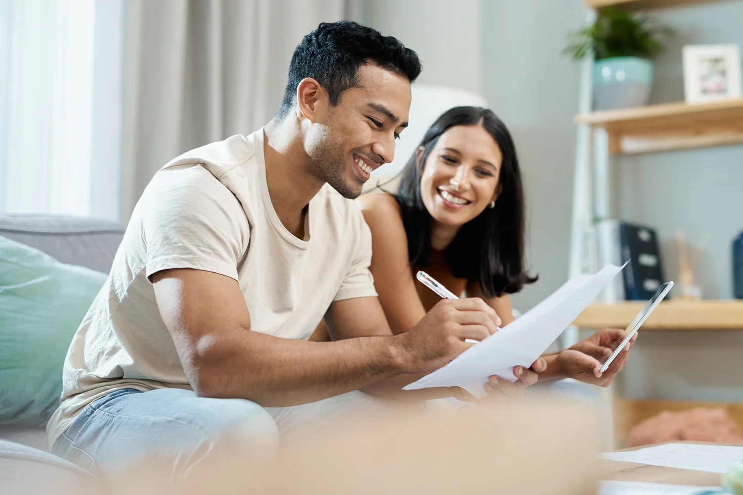 Houston homeowners reviewing property tax documents and signing appeal paperwork with Tax Cutter property tax protest services.