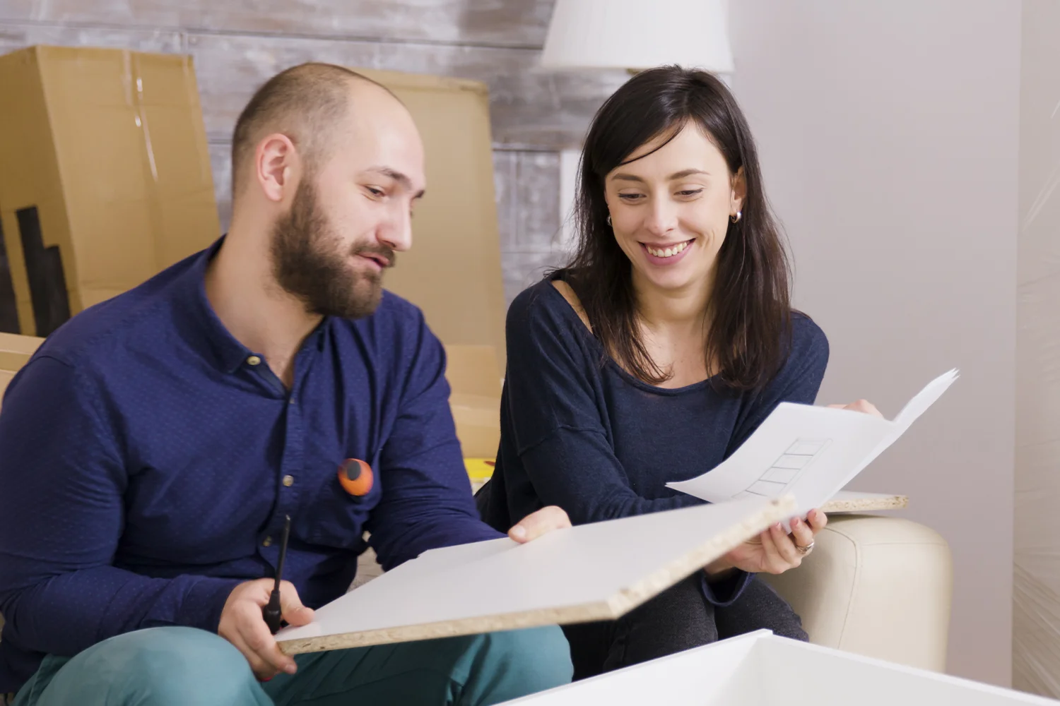 Houston homeowners reviewing property documents together, representing property tax protest and appeal assistance by Tax Cutter. 