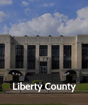 Liberty County Courthouse with stone façade and tall windows, reflecting property tax assessment and appeal services handled by Tax Cutter.