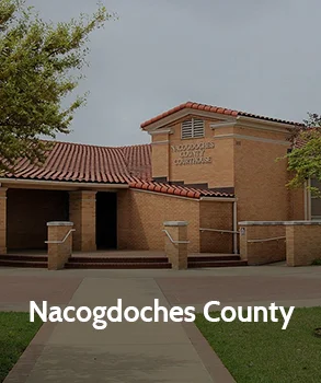 Nacogdoches County Courthouse in Texas with red tile roof, representing Houston property tax protest and appeal services by Tax Cutter.