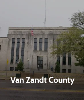 Van Zandt County Courthouse in Texas with stone façade and tall windows, representing local property tax appeal services.